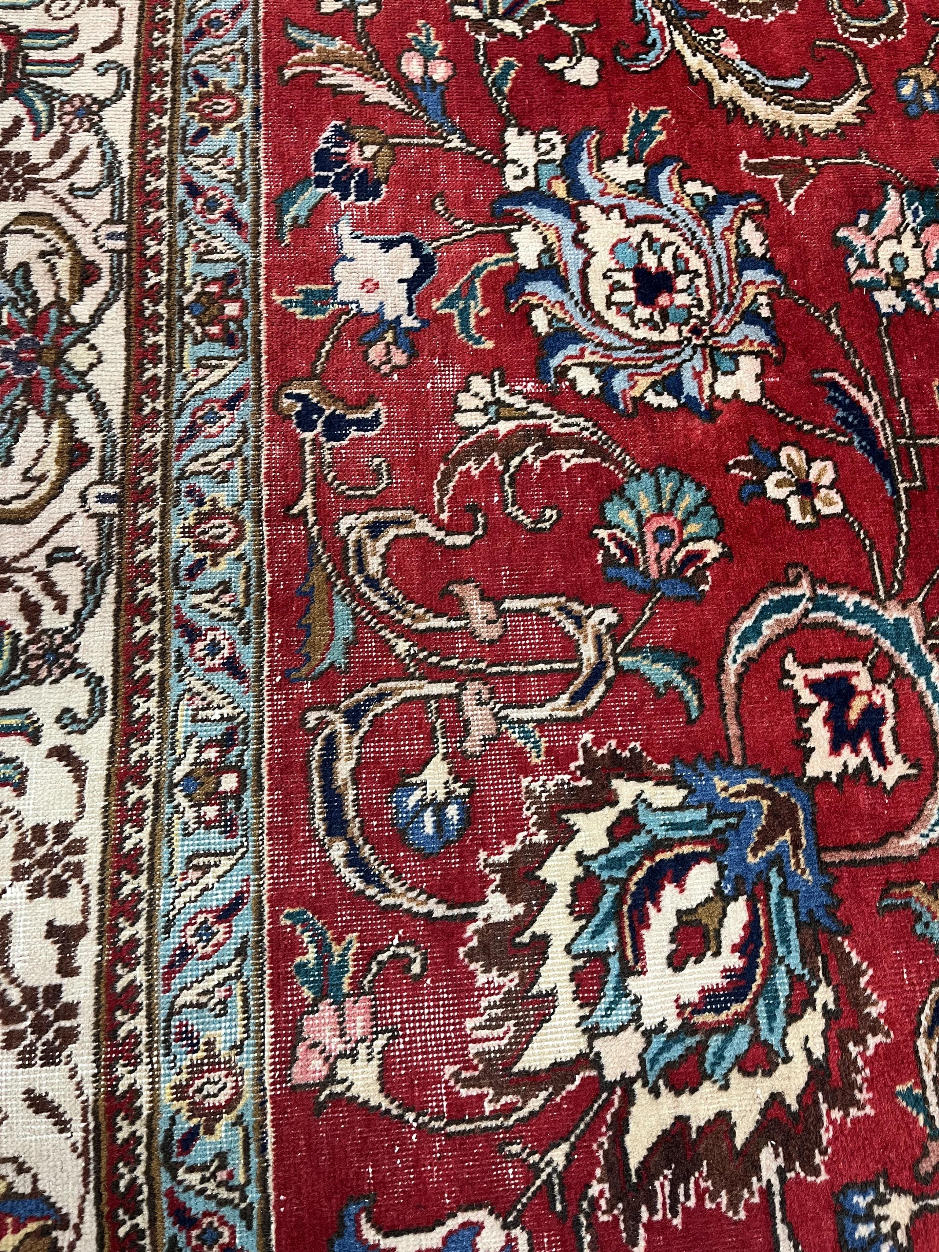 A Persian red ground carpet, worn, 340 x 340cm. Condition - fair